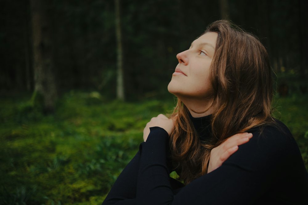 A person breathing calmly in a forest